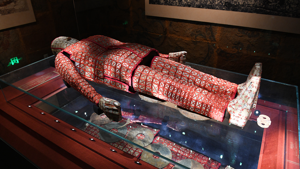 The jade burial suit made with red threads is on display at the Museum of the Mausoleum of the Nanyue King in Guangzhou, China. /CFP