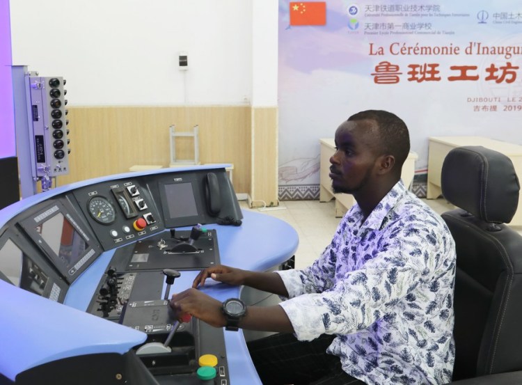 A student shows a train driving simulator at the Djibouti Luban Workshop at Djibouti Industrial and Commercial School in Djibouti City, capital of Djibouti, on Sept. 19, 2022. (Xinhua/Dong Jianghui)
