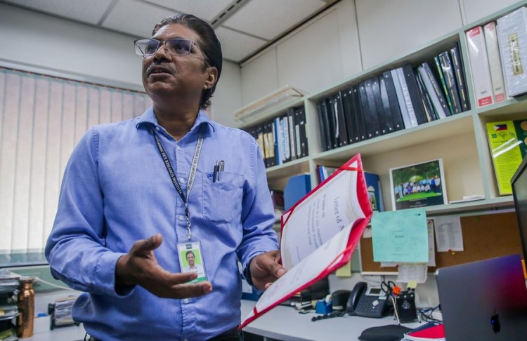 Jauhar Ali, a hybrid rice breeder at the International Rice Research Institute (IRRI), speaks during an interview with Xinhua in his office in Laguna Province, the Philippines on May 16, 2023. (Xinhua/Rouelle Umali)
